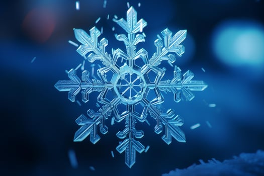 Intricate snowflake falling on a snowy surface in winter wonderland photo