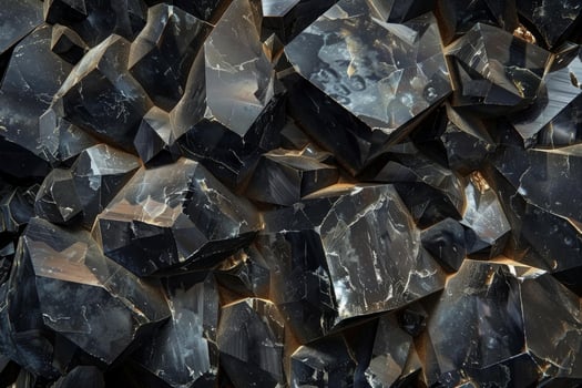 Background of black obsidian crystals showing natural facets photo