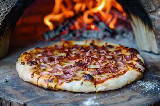 Delicious pizza baking in a wood fired oven photo