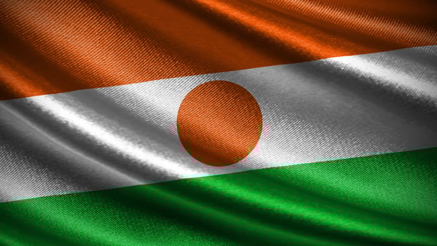 Niger flag with realistic silky wave texture photo