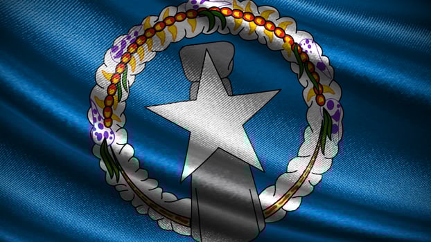 Northern Mariana Islands flag with realistic silky wave texture photo