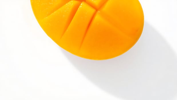 Fresh mango sliced and ready to enjoy on a clean surface photo