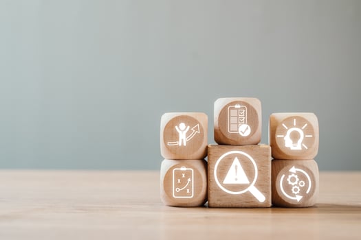 Wooden blocks with icons symbolizing crisis management, strategy, and solutions for business challenges. photo