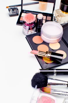 Brush and cosmetic isolated on a white background. Top view. photo