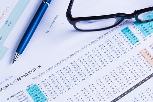 Business performance graph with ballpoint pen photo