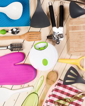 cookware and accessories on a wooden table. photo