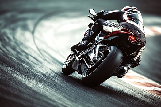 Professional motorcycle racer taking turn on track at high speed photo