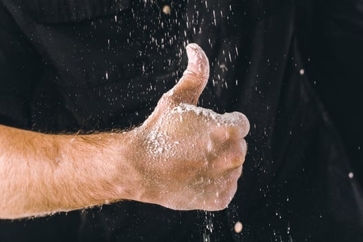 adult man hands work with flour, dark photo