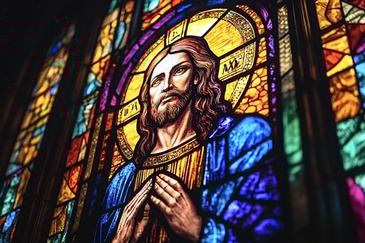 Stained glass window depicting jesus christ praying in church photo