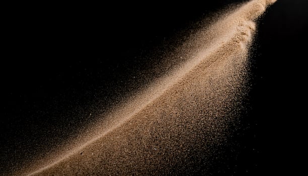 Soft Brown Sand on Dark Background, Front Perspective photo