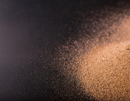 Brown Beach Sand on Black Background, Texture and Pattern photo