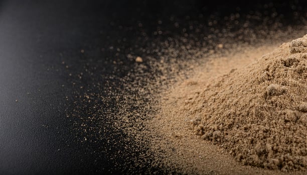 Brown Desert Sand on Black Surface, High-Detail Close-up photo