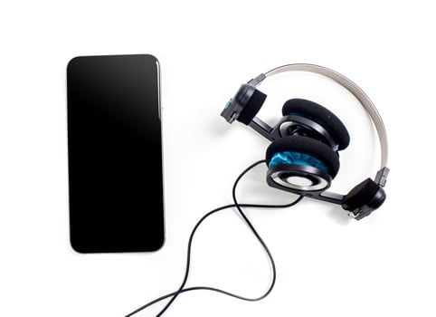 audio player with headphones isolated on white background photo