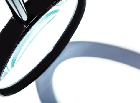 Magnifying glass isolated on white photo