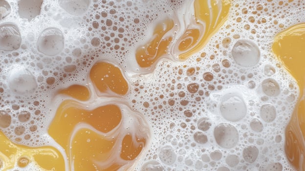 Close up of frothy liquid with yellow substance photo