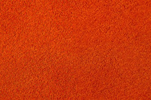 Warm red or orange suede as a background. photo