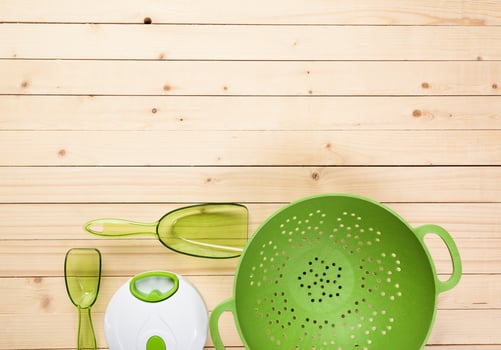 Various kitchen utensils on wooden table photo