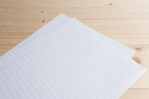 close-up of ball point pen over lined paper photo