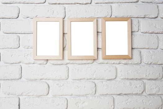 blank black picture frame on the wall photo