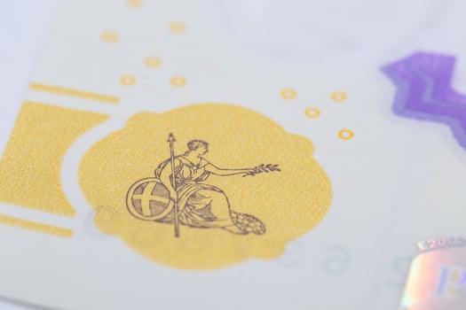 Close-up of Banknote Emblem Seated Figure with Spear and Olive Branch photo