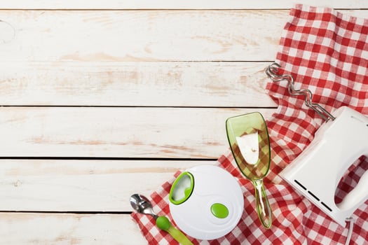 Various kitchen utensils on wooden table photo