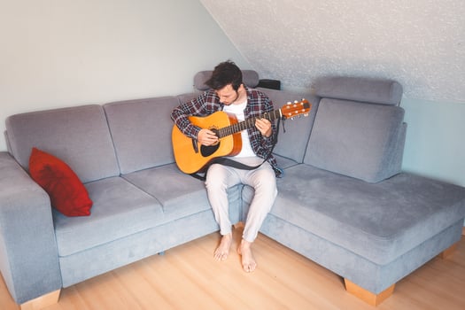 Unwinding with guitar in a warm and simple space photo