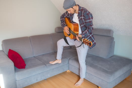 Guitarist unwinds through peaceful music playing photo