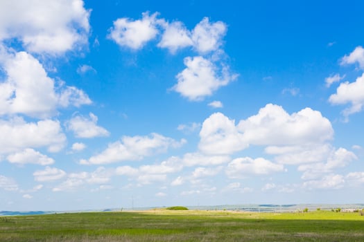 Green field and blue sky photo