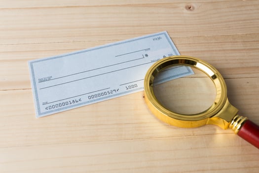 Banking Check with magnifier glass photo