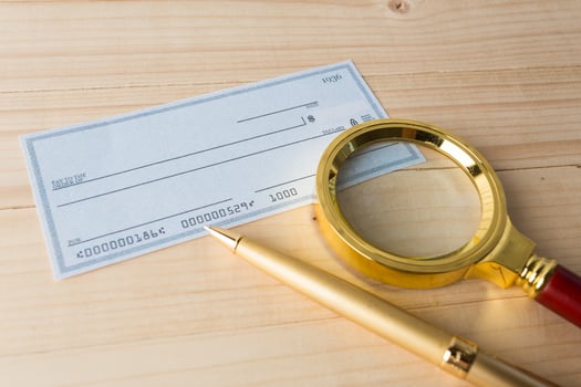 Banking Check with magnifier glass photo