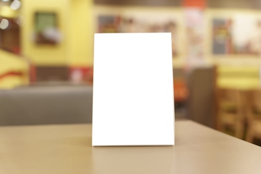 blank white menu on table in restaurant photo