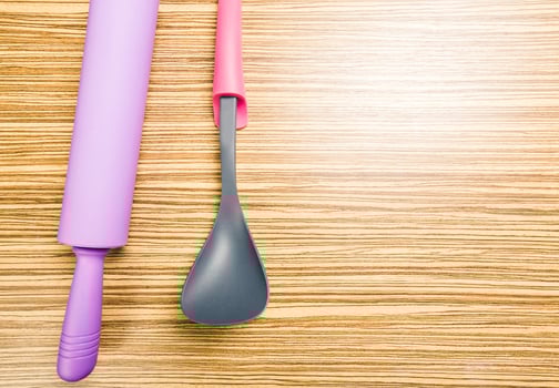 kitchenware on wooden background photo