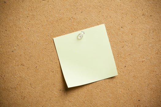 Color sticker notes over cork board background photo