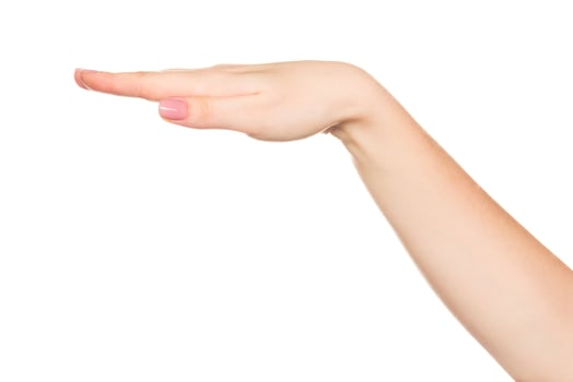 Hand gesture demonstrating a flat surface or level position in a neutral background setting photo