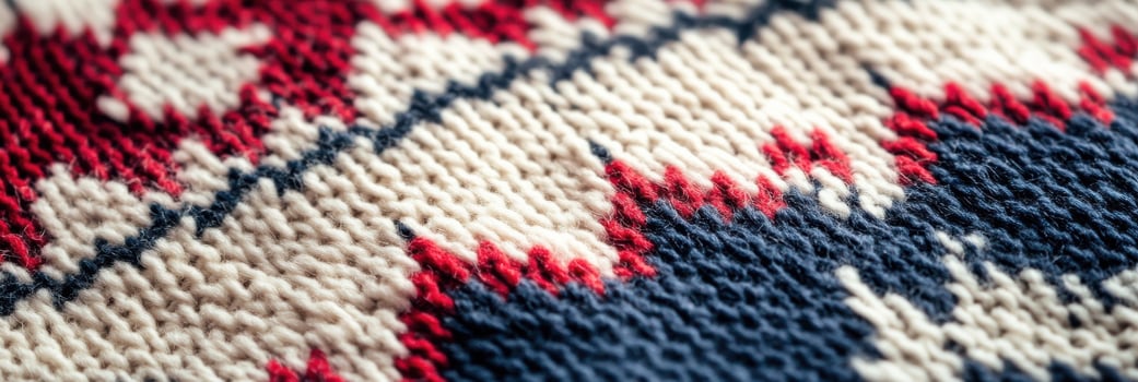 Close-up of knitted fabric with red, white, and blue pattern in a zigzag design photo