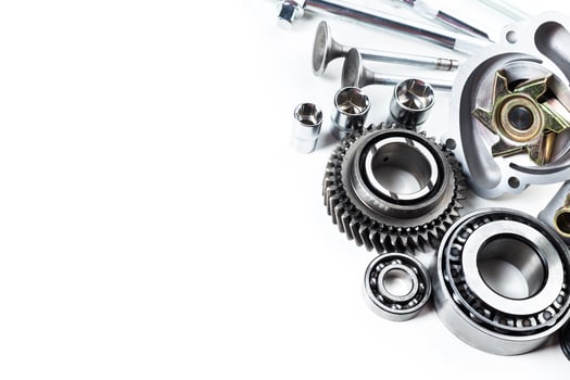 Detailed collection of mechanical components arranged artistically on a neutral background photo