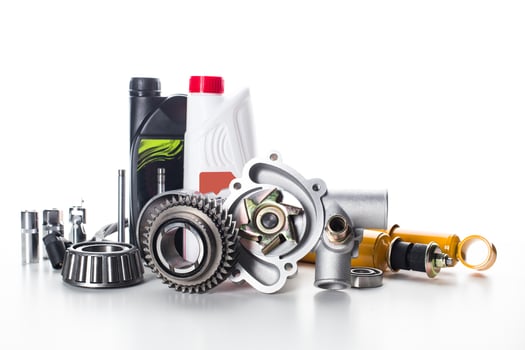 Various automotive components and tools arranged on a white background for garage use and maintenance tasks photo