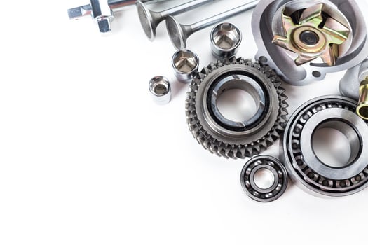 Various Mechanical Parts Arranged Neatly on a White Surface for Assembly and Repair Work photo