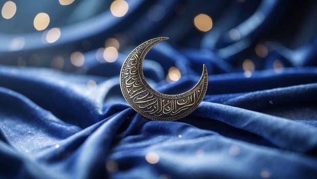 Intricate crescent moon design on blue fabric with sparkling lights creating a serene atmosphere photo