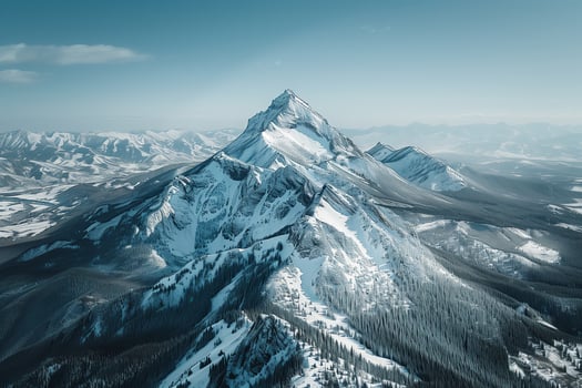 A mountain range with snow on top photo