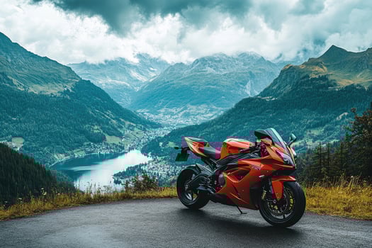 Sport motorcycle parked on asphalt road with mountain view and fog photo