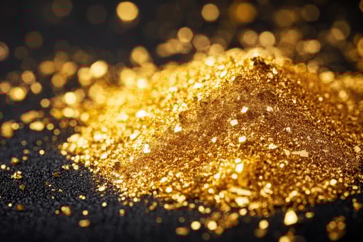 Gold glitter shining brightly on a dark background with bokeh effect photo