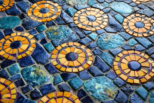 Colorful mosaic floor with circular patterns creating a vibrant design photo