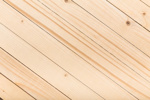 Natural pine wood surface with distinct grain patterns suitable for various design and crafting projects photo