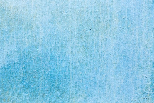 Textured blue background with subtle variations in tone and appearance creates a calming ambiance perfect for art or design projects photo