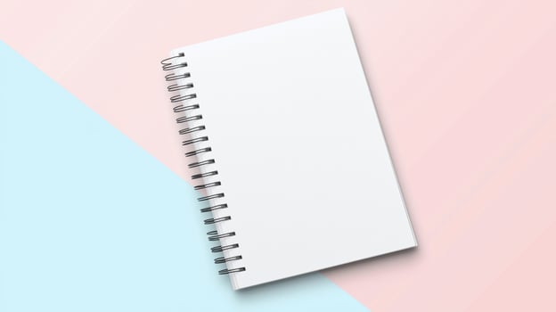 A blank notebook on a pink and blue background photo