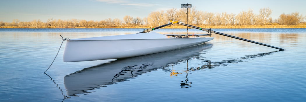 rowing shell by on a lake in northern Colorado in winter or early spring scenery. photo