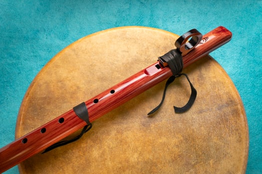 native American style flute handcrafted from aromatic cedar and shaman drum coverd by gout skin photo