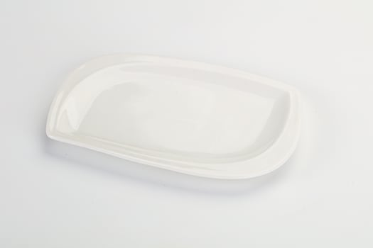 A white plate with a small square shape photo