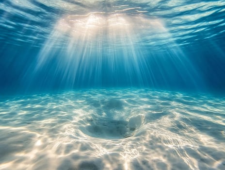 Underwater sunbeam on the ocean floor photo